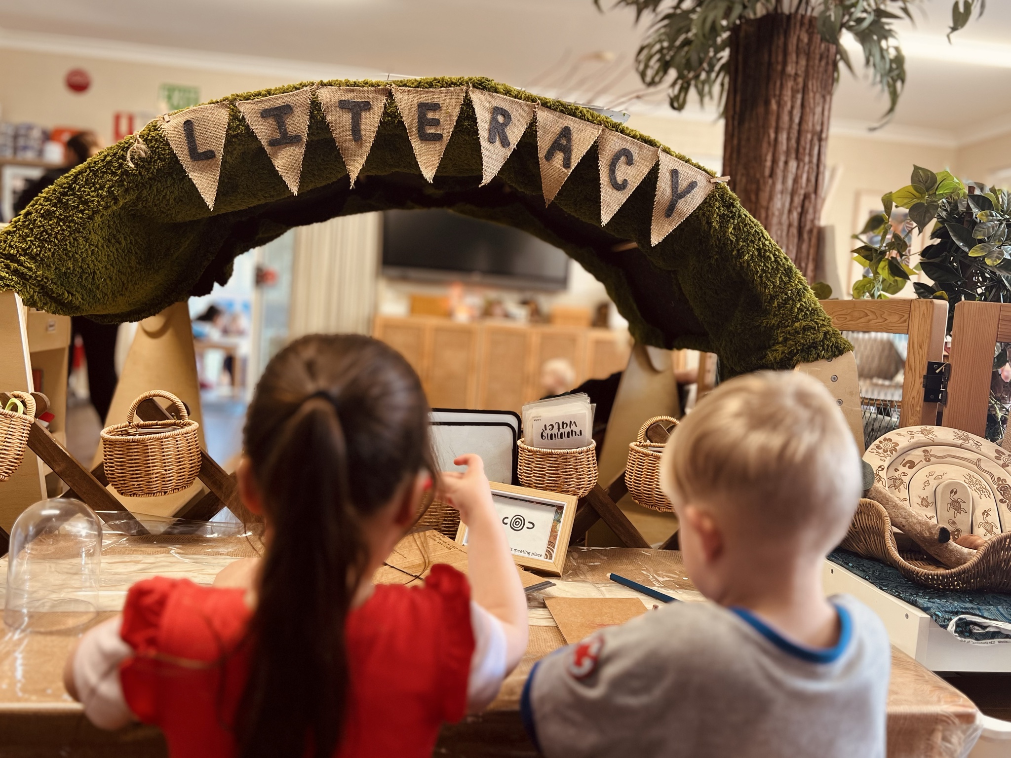 Children engaging with literacy experiences at Lakeview Preschool